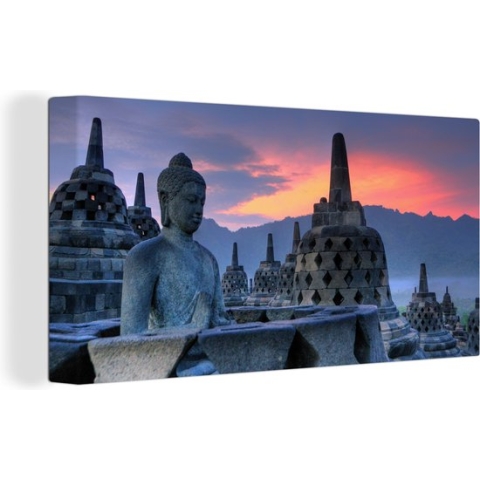 Canvas Schilderij Oranje lucht boven de Borobudur tempel in Indonesië - 160x80 cm - Wanddecoratie