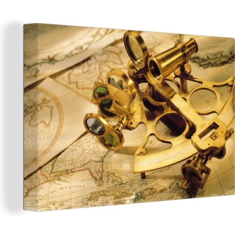 Canvas Wereldkaart - 120x80 - Wanddecoratie Een sextant om mee te navigeren bovenop wereldkaarten